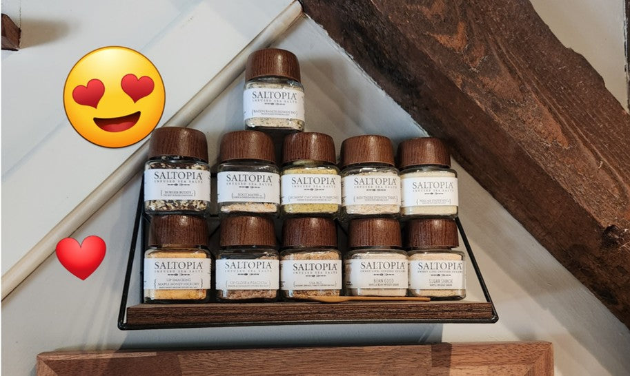 SALTOPIA customer displaying their large infused sea salt collection from their home kitchen