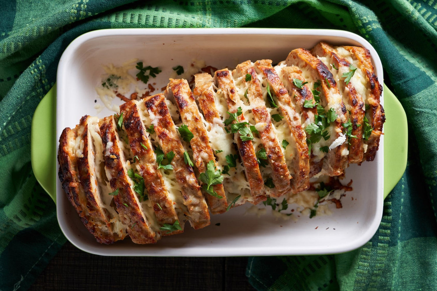 Sliced fall meatloaf with beef, pork, and veal topped with melted cheese, made with SALTOPIA LOVIN' MY PUMPKIN pumpkin spice sugar