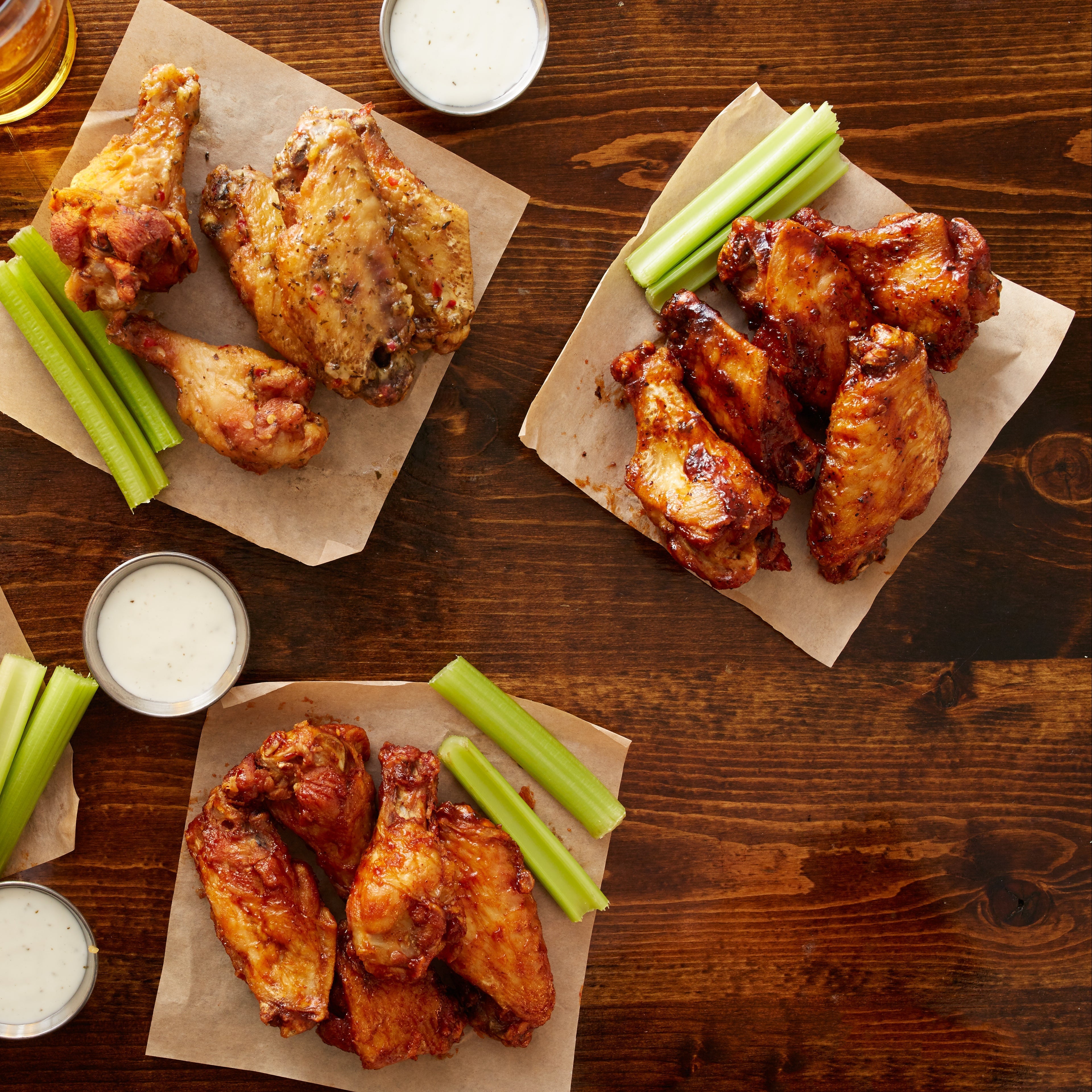 Four styles of crispy chicken wings seasoned with SALTOPIA infused sea salt, sauced and ready to serve