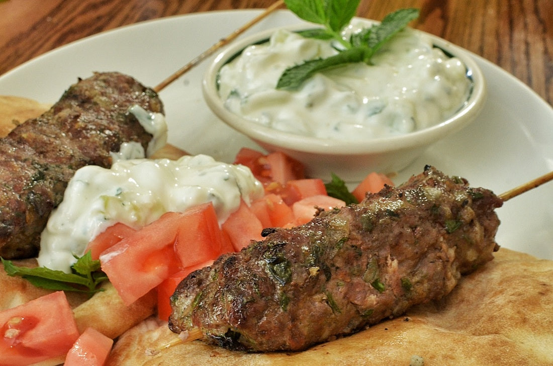 A gyro wrap filled with seasoned ground lamb, topped with SALTOPIA infused sea salt