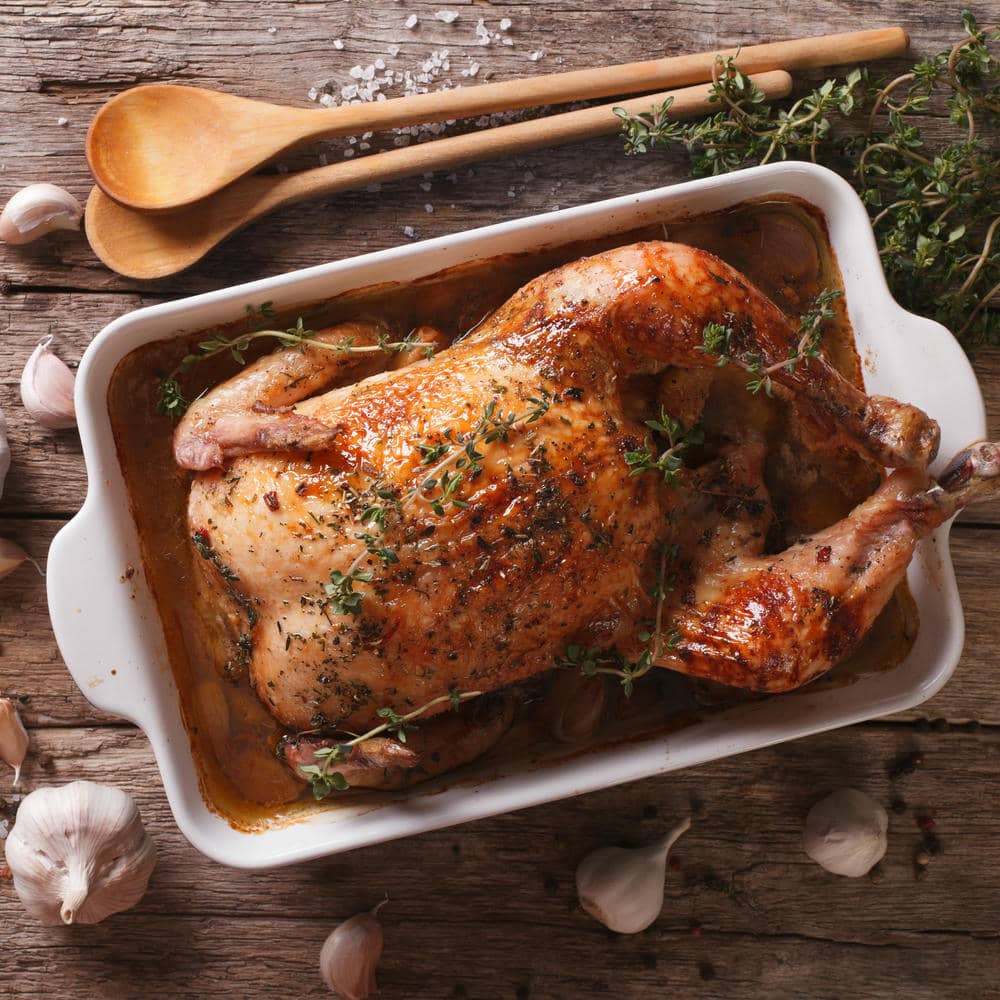 A slow-roasted whole chicken seasoned with SALTOPIA infused sea salt, herb-crusted and beautifully browned